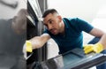 Man with rag cleaning inside oven at home kitchen Royalty Free Stock Photo