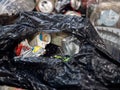 Household waste in a black plastic bag