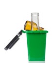 Household waste sorting concept. Green trash bin for glass rubbish bottles isolated on white Royalty Free Stock Photo