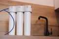 Household water purification system. Three-stage water treatment and softening system.