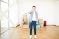 Householder Smiling While Showing Keys In New Apartment