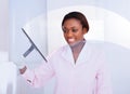 Housekeeper cleaning glass in hotel Royalty Free Stock Photo