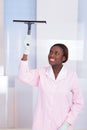 Housekeeper Cleaning Glass In Hotel Royalty Free Stock Photo