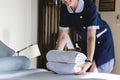 Housekeeper cleaning a hotel room Royalty Free Stock Photo