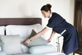 Housekeeper cleaning a hotel room Royalty Free Stock Photo