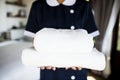 Housekeeper handing a new set of towels