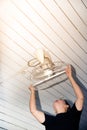 The maidservant is installing and cleaning the ceiling fan. Royalty Free Stock Photo