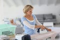 Housekeeper ironing clothes Royalty Free Stock Photo