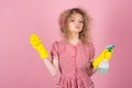 Housekeeper in rubber gloves with cloth and sprayer. Lady housekeeper ready to clean. Cleaning at its finest