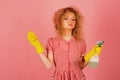 Housekeeper in rubber gloves with cloth and sprayer. Lady housekeeper ready to clean. Cleaning at its finest