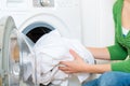 Housekeeper with washing machine Royalty Free Stock Photo