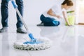 Housekeeping and cleaning concept, Young couple in blue rubber g Royalty Free Stock Photo