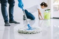 Housekeeping and cleaning concept, Young couple in blue rubber g Royalty Free Stock Photo