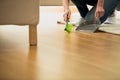 Person using brush and dustpan