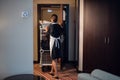 A housekeeping lady in a uniform doing room service in a hotel