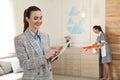 Housekeeping manager with tablet checking maid work in hotel room Royalty Free Stock Photo