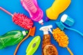 Housekeeping tool. Detergents, soap, cleaners and brush for housecleaner work on blue background top view space for text