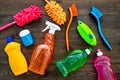 Housekeeping tool. Detergents, soap, cleaners and brush for housecleaner work on wooden background top view space for