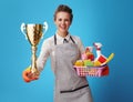 Housemaid with a basket with detergents and brushes