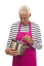 Houseman with pink apron and cooking pan Royalty Free Stock Photo