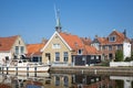 Houses along a canal in Makkum, an old Dutch village Royalty Free Stock Photo