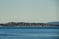 Houses along the coast in the city of Victoria which sits on the Strait of Juan de Fuca