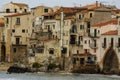 Houses along the shoreline and cathedral in background, Cefalu,