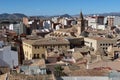 Houses around the Church of Santiago Apostol with mountains in the background. Villena, Alicante, Spain Royalty Free Stock Photo