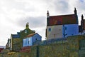 Houses behind the seawall in Robin Hood`s Bay,Old Town, North Yorkshire. Royalty Free Stock Photo