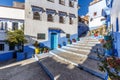 Houses in the blue town Chefchaouen with colourful flower pots