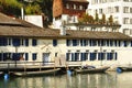 Houses and boats along Limmat river, Zurich, Switzerland Royalty Free Stock Photo