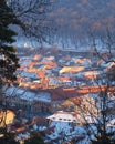 Houses in Brasov city, Romania, during a Winter sunset - view from an elevated position above the city Royalty Free Stock Photo