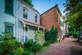 Houses and brick sidewalk in the Old Town of Alexandria, Virginia. Royalty Free Stock Photo