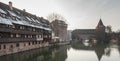 Houses and a bridge reflected in a river in the old town of Nuremberg seen from Henkersteg covered bridge across Pegnitz river Royalty Free Stock Photo