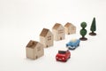 Houses, cars, and trees on white background. Royalty Free Stock Photo