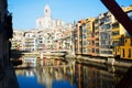 Houses and church on river bank of Onyar from Eiffel bridge in Gerona Royalty Free Stock Photo