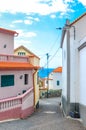 Houses in coastal city Jardim do Mar, Madeira, Portugal. Waters of the Atlantic ocean in the background. Narrow street. Generic Royalty Free Stock Photo