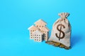 Houses and dollar money bag. Real estate investment and rental business. Increasing property value. Fair market price. Home