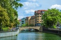 Houses on the embankment, bridge. City landscape with a river and houses. Royalty Free Stock Photo