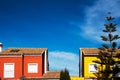 Houses with facade of Mediterranean colors and intense blue sky