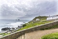 Houses and fishing jetty at cape Cornwall Royalty Free Stock Photo