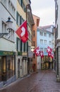 Houses with flags of Switzerland in Zurich. Zurich old town. The historical part of Zurich