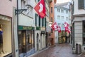 Houses with flags of Switzerland in Zurich. Zurich old town. The historical part of Zurich