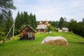 Rural landscape with an old wooden church in small village Royalty Free Stock Photo