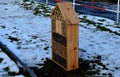 butterflies for moths and butterflies. in a city park on a housing estate in the winter stands in the snow road barrier Royalty Free Stock Photo