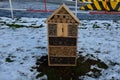 butterflies for moths and butterflies. in a city park on a housing estate in the winter stands in the snow road barrier