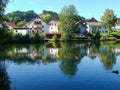 Houses laid against a pond in Peiting, Germany Royalty Free Stock Photo
