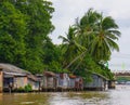 Houses of local people staying along river Royalty Free Stock Photo