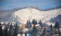 Houses in the mountains in winter snow nature resort Royalty Free Stock Photo