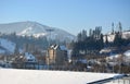 Houses in the mountains in winter snow nature resort Royalty Free Stock Photo